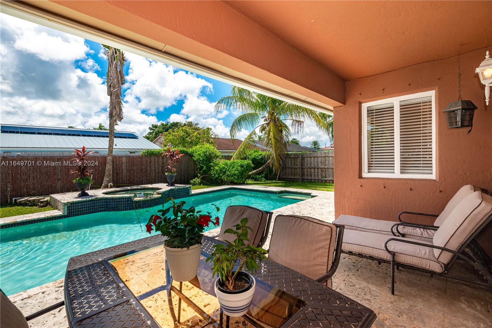 a view of swimming pool with outdoor seating