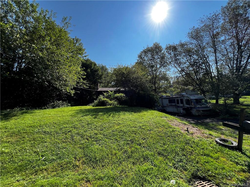 a backyard of a house with lots of green space