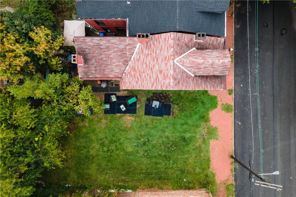 a aerial view of a house with a yard