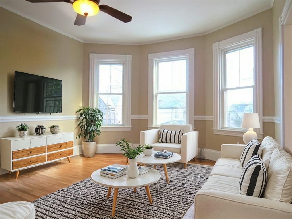 a living room with furniture and a flat screen tv