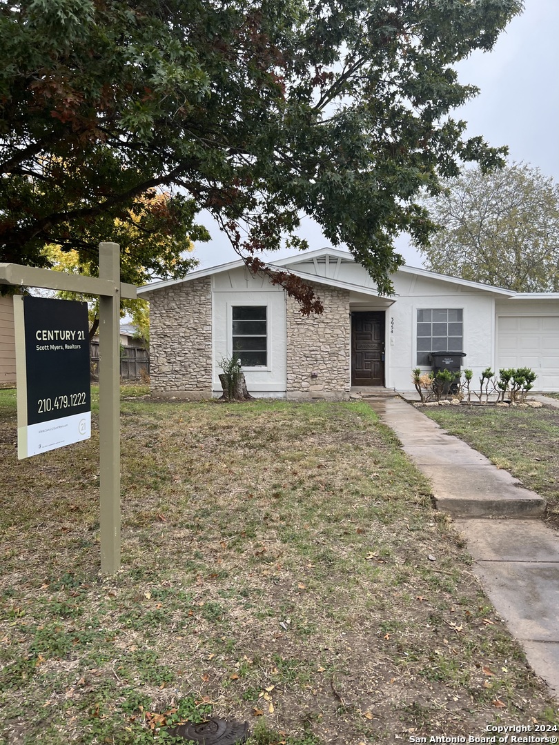 a front view of a house with yard