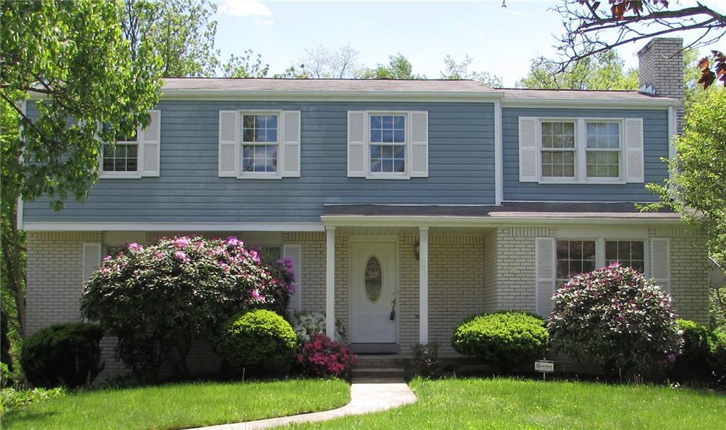 a view of a house with a garden