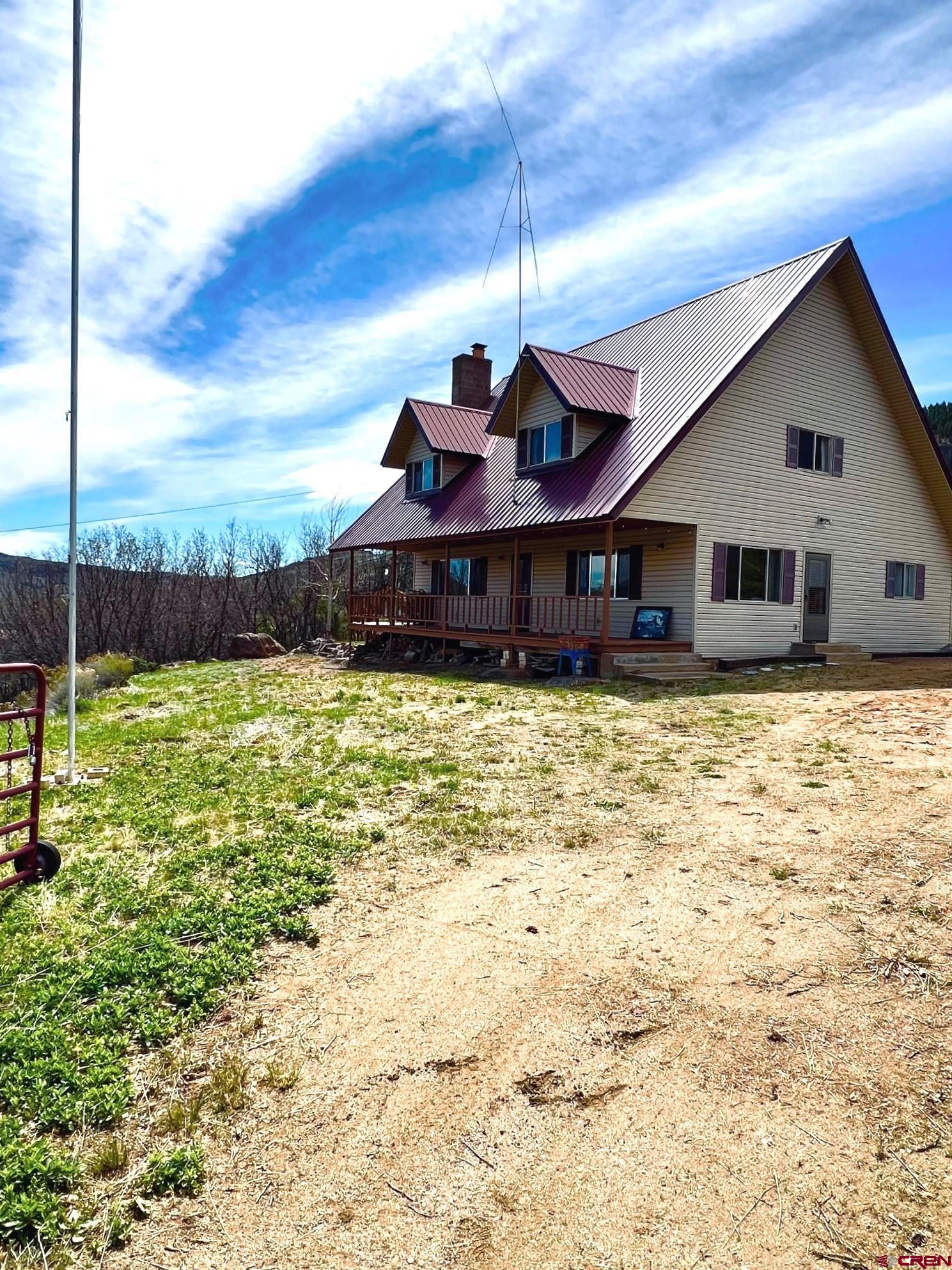 a view of a house with a yard