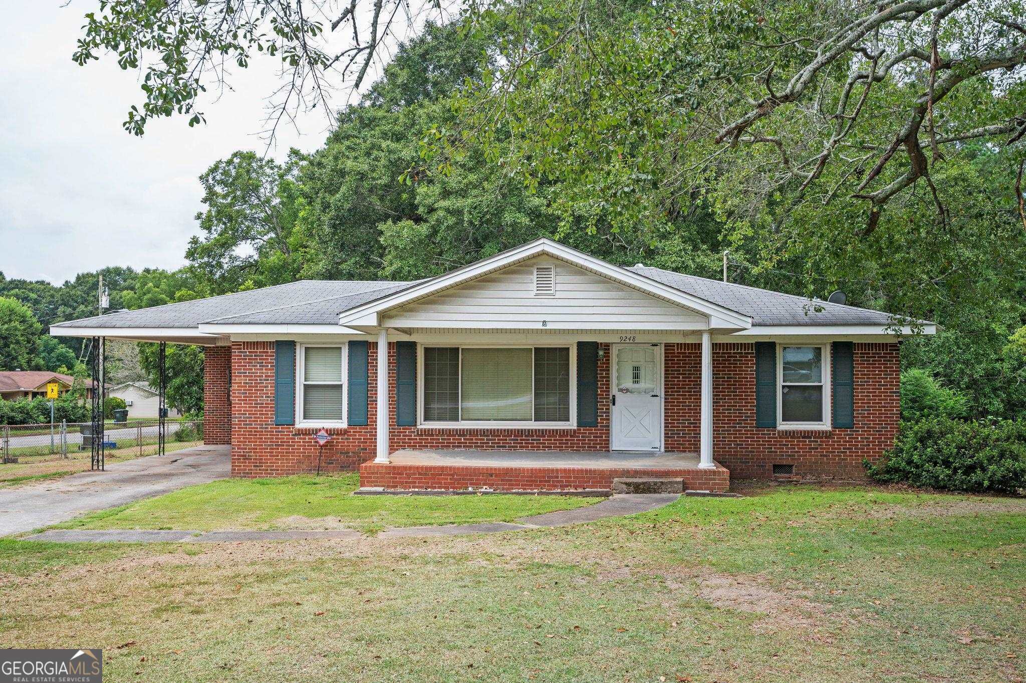 a front view of a house with a yard and porch