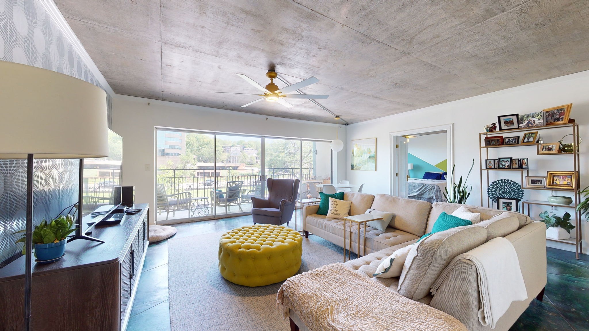 a living room with furniture and a flat screen tv