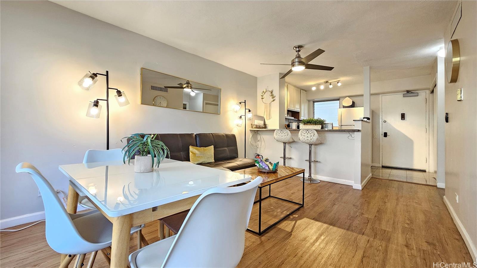 a view of a dining room with furniture and wooden floor