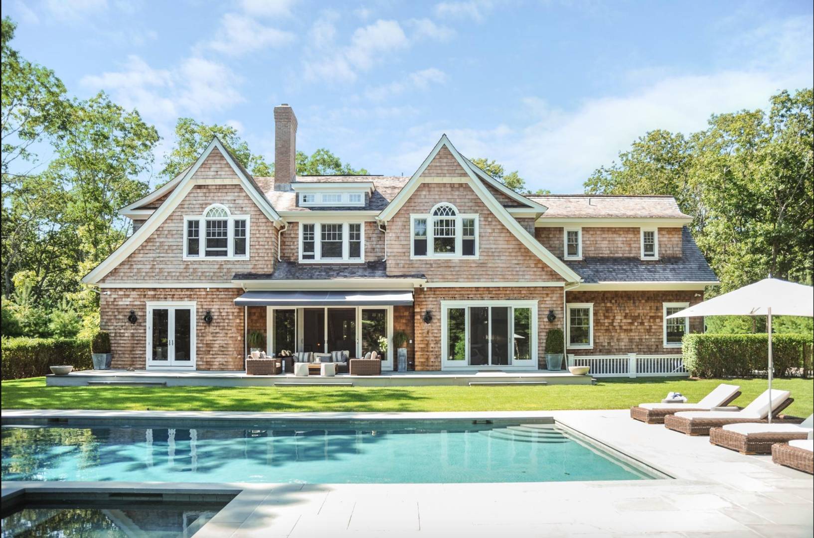 a house with swimming pool and porch