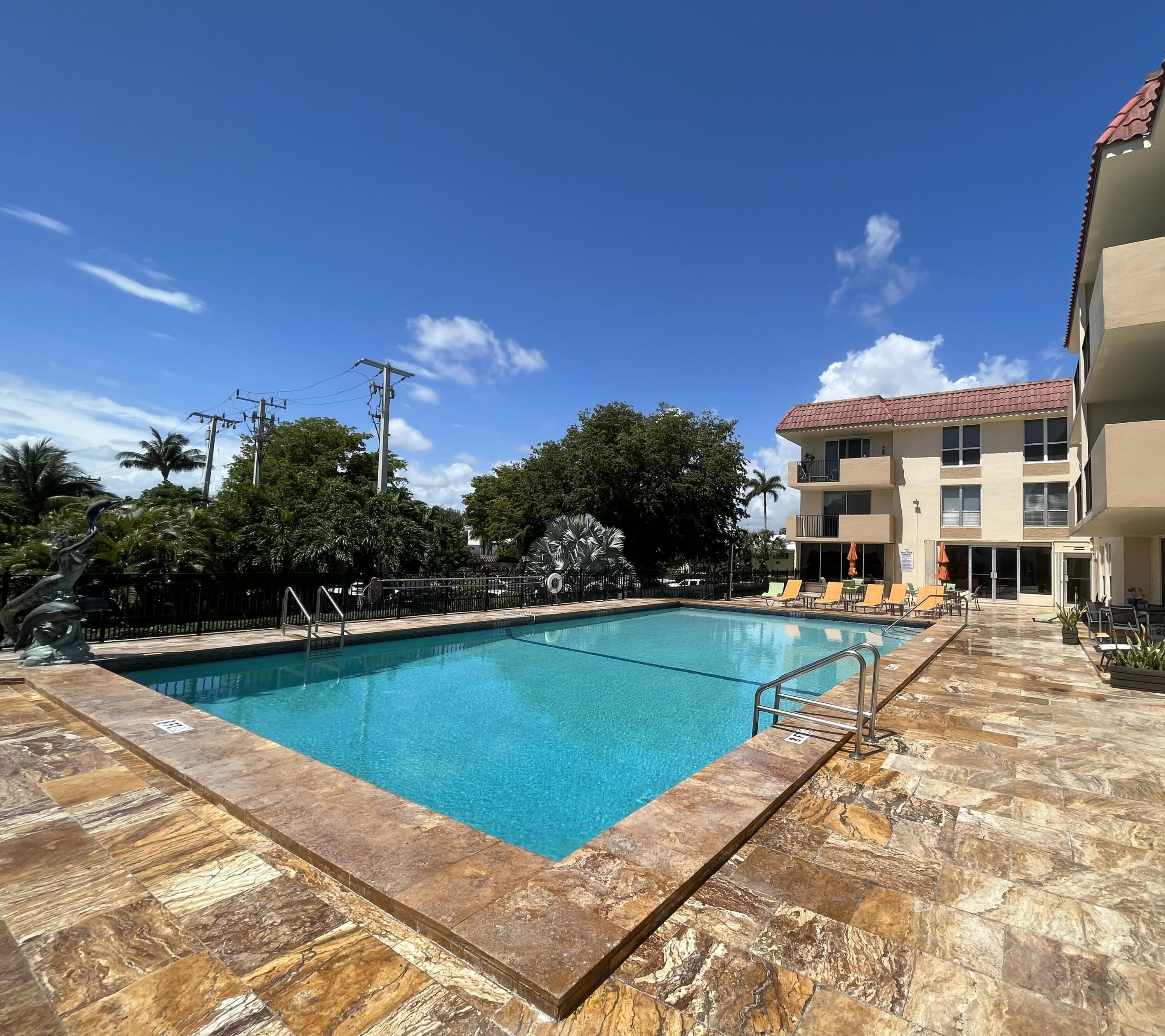 a view of a swimming pool with a patio