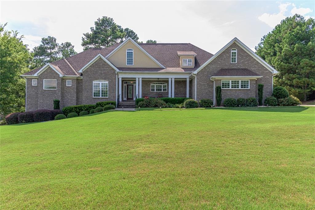 a front view of a house with a yard