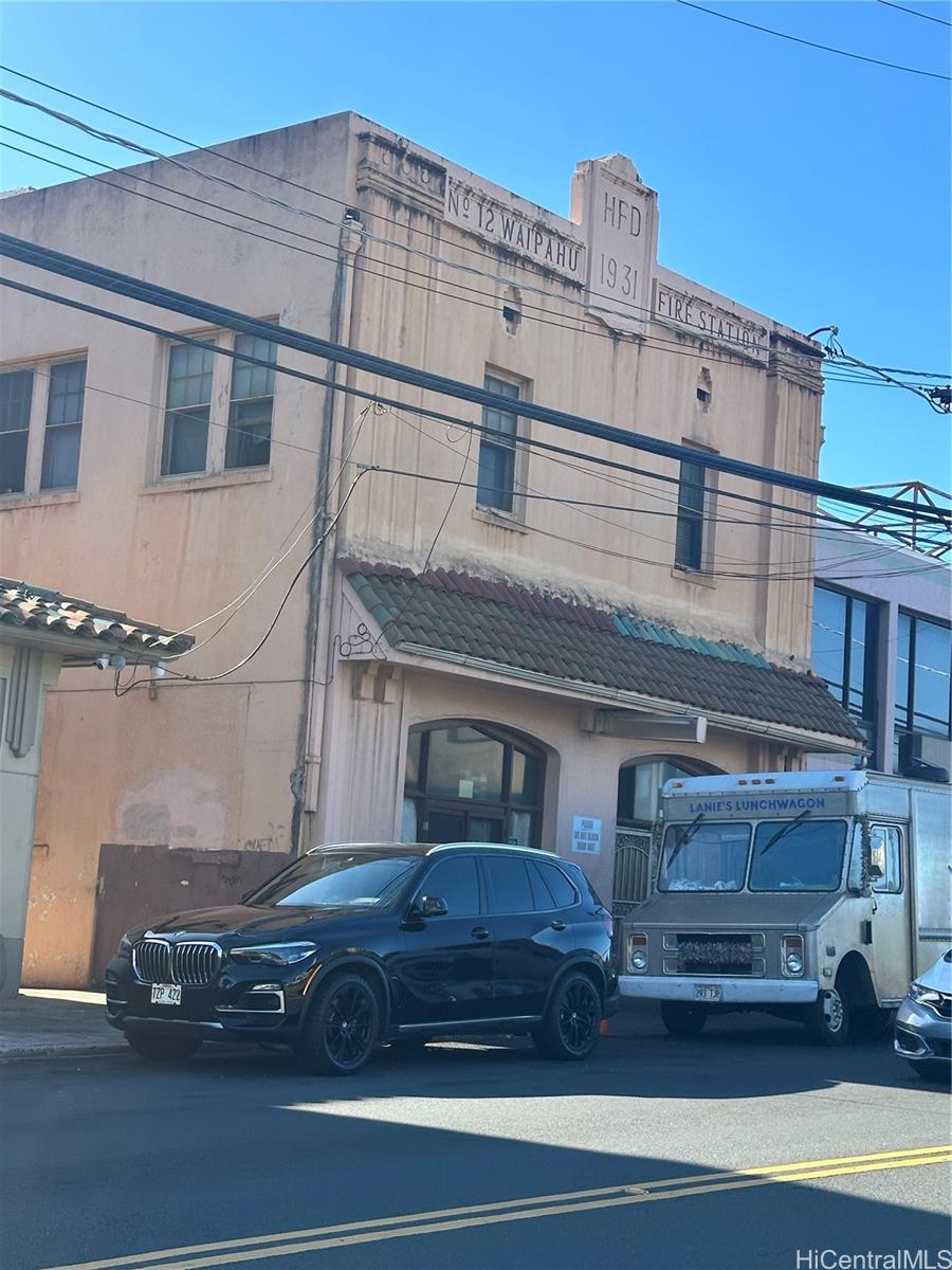 a view of a car parked in front of a building