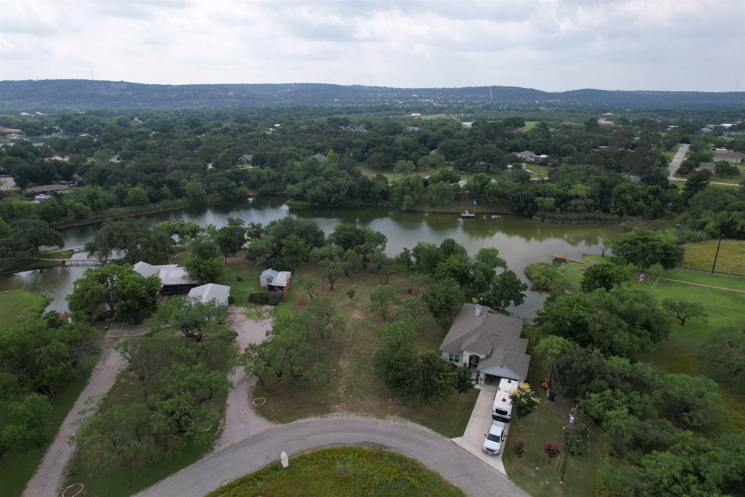 an aerial view of house with yard and outdoor seating