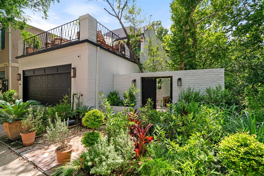 a view of a house with potted plants