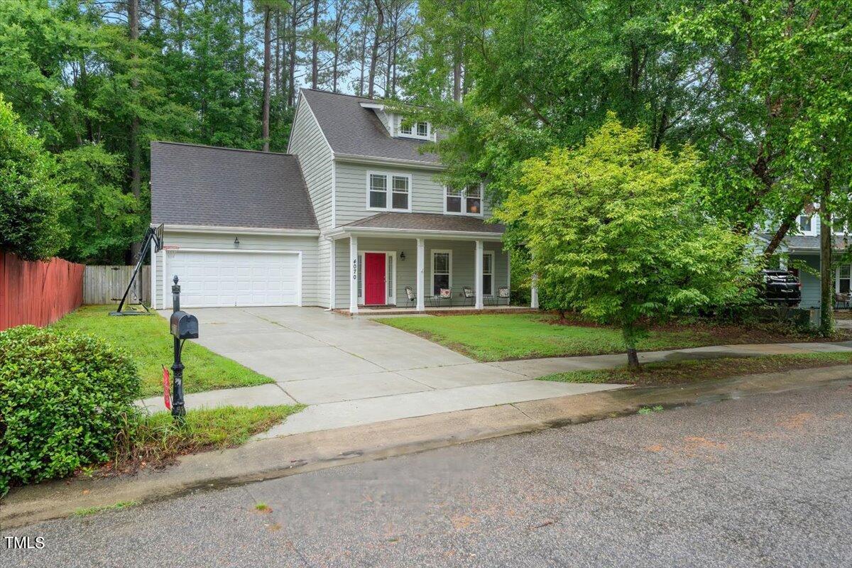 a house that has a tree in front of it