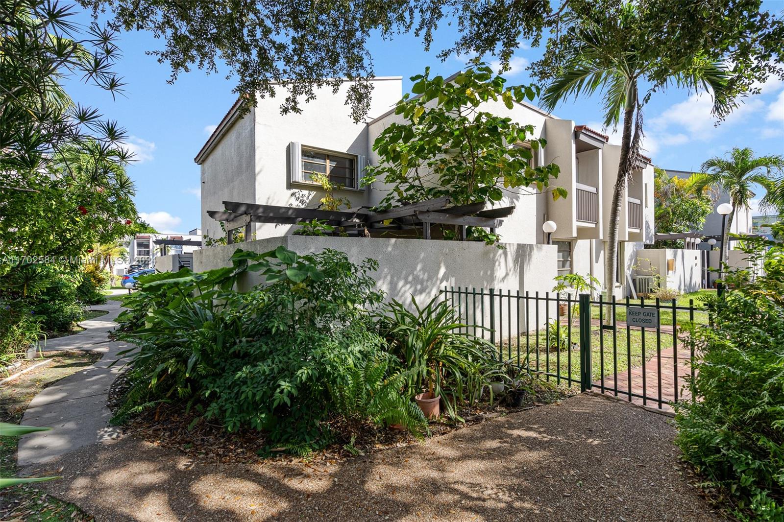 a view of a wrought iron fences in front of house