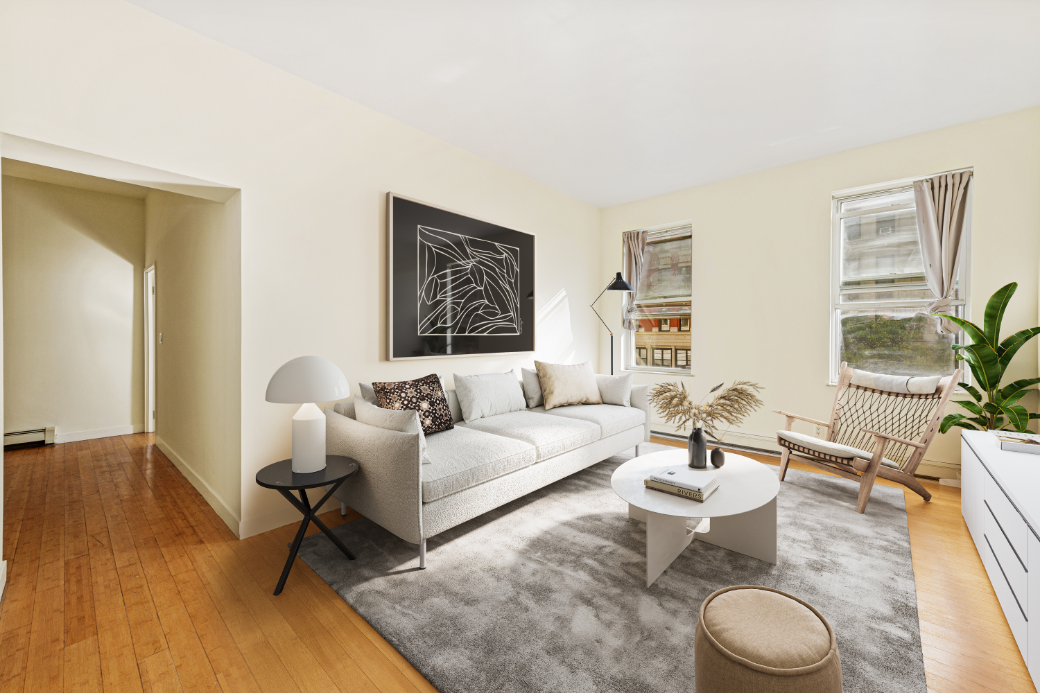 a living room with furniture and a rug