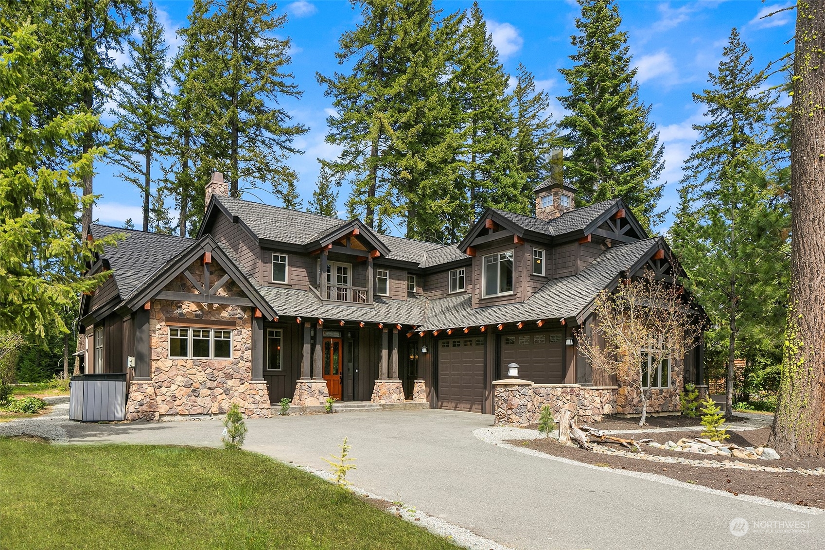 a front view of a house with a yard and outdoor seating