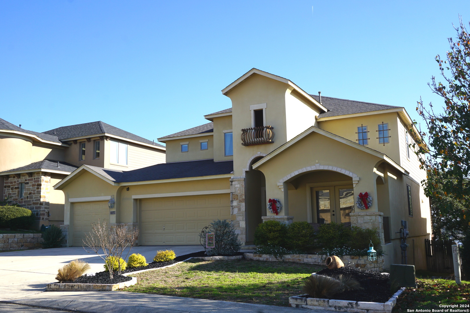 a front view of a house with garden