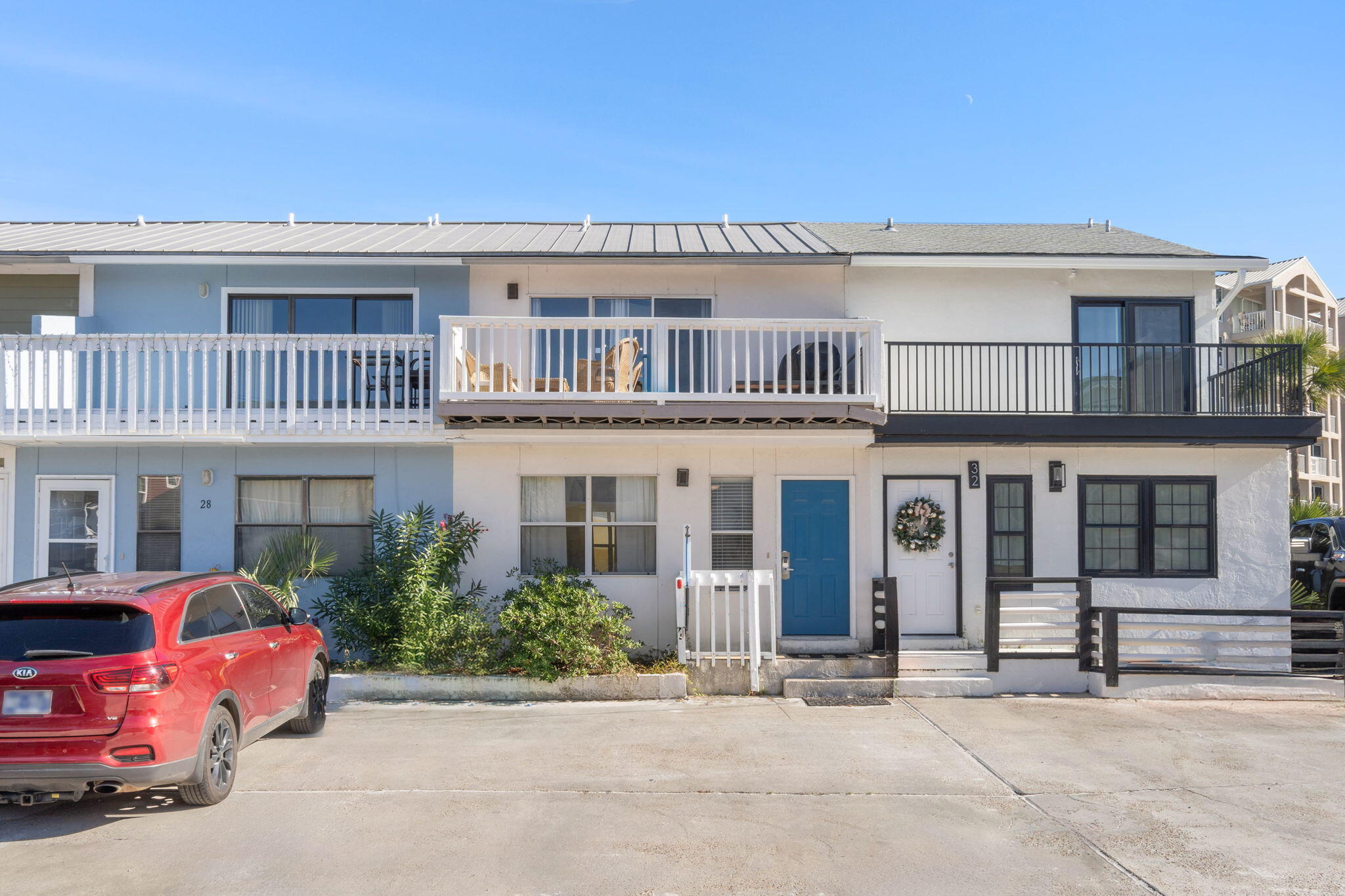 a front view of a house with parking area