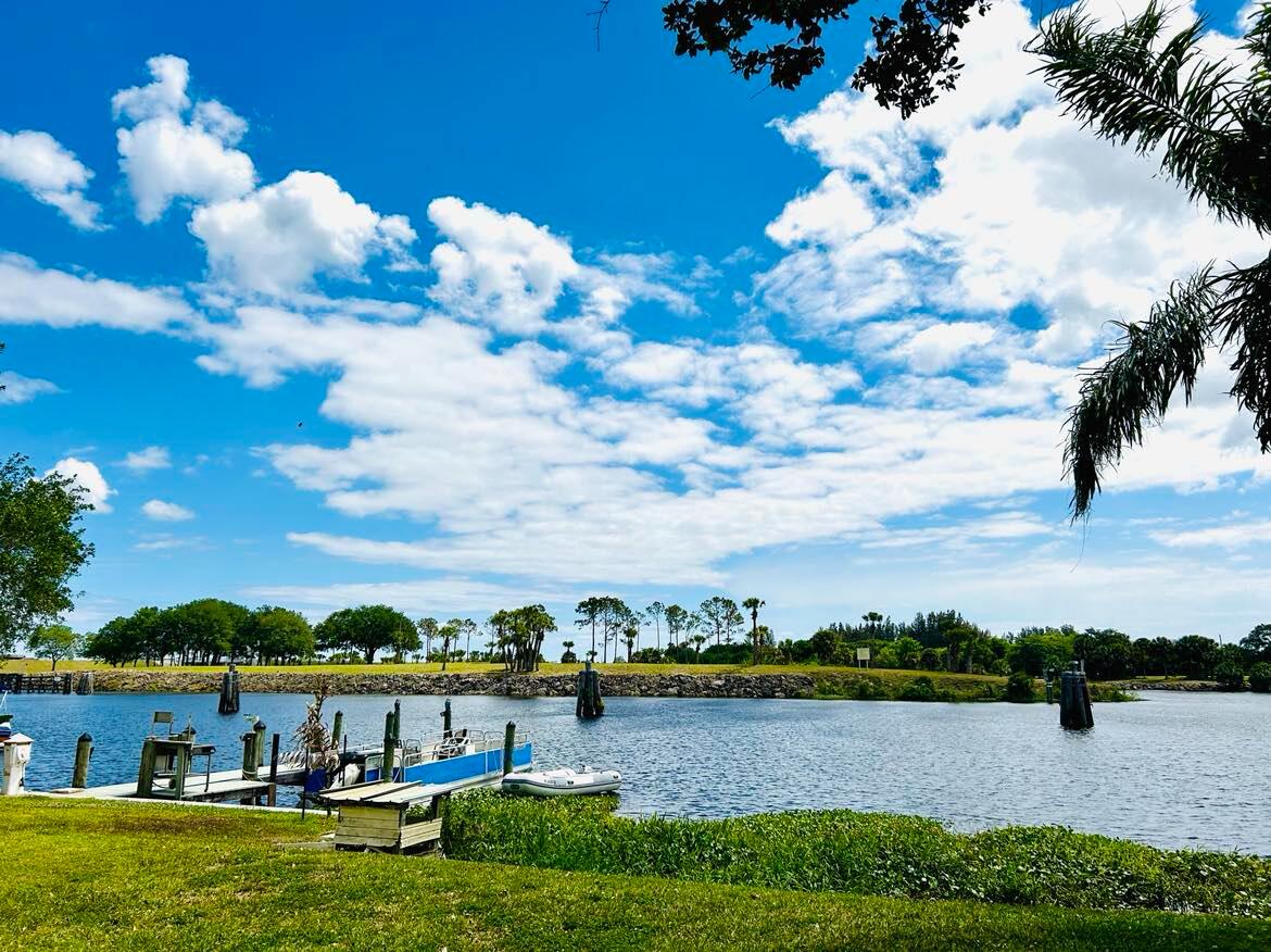 a view of a lake with houses in the back