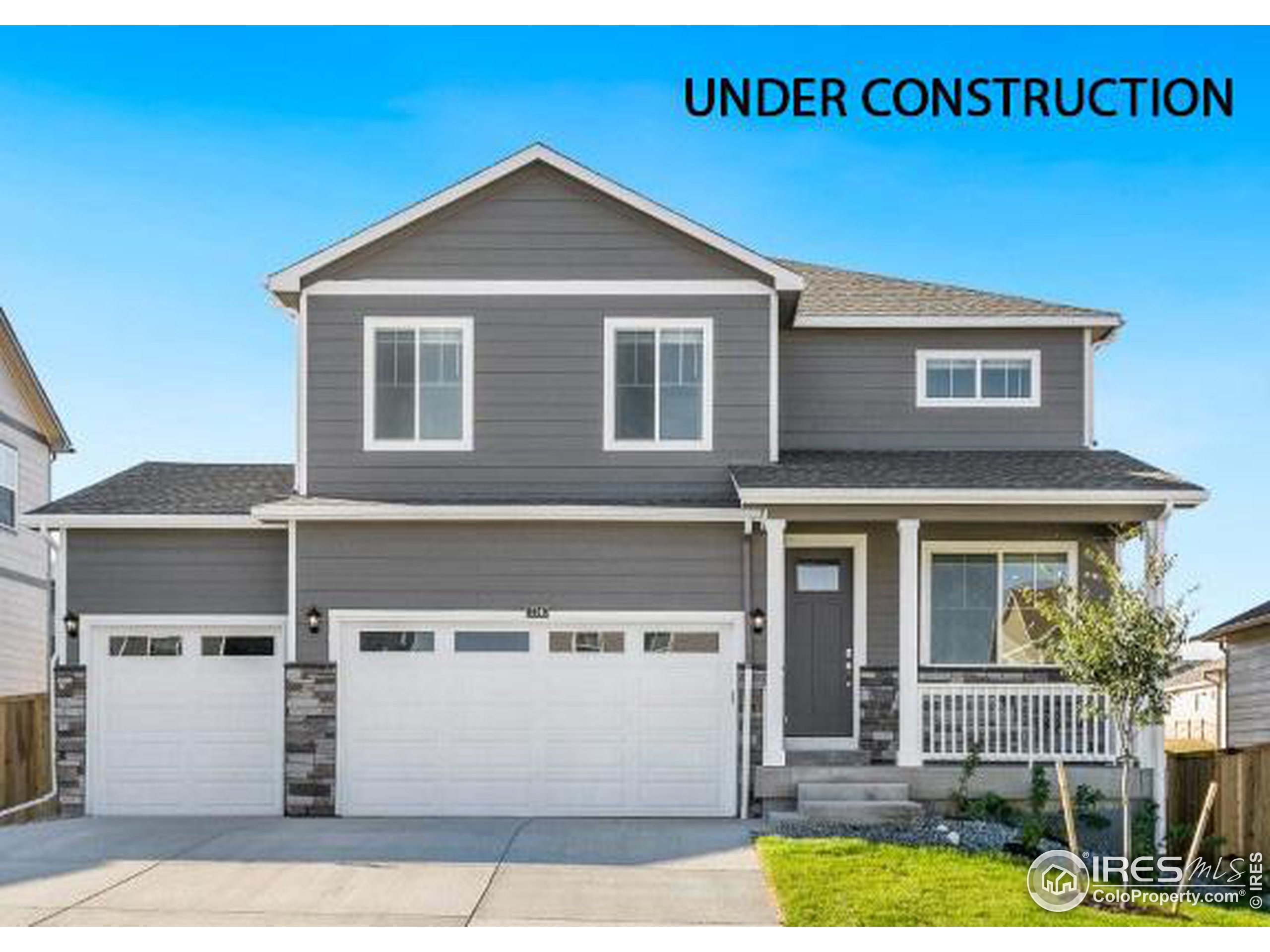 a front view of a house with garage