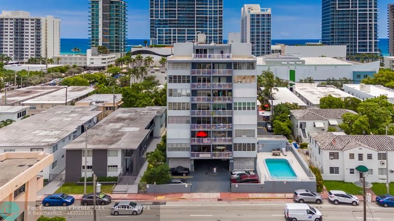 a aerial view of multi story residential apartment building