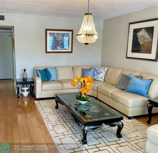 a living room with furniture and a table