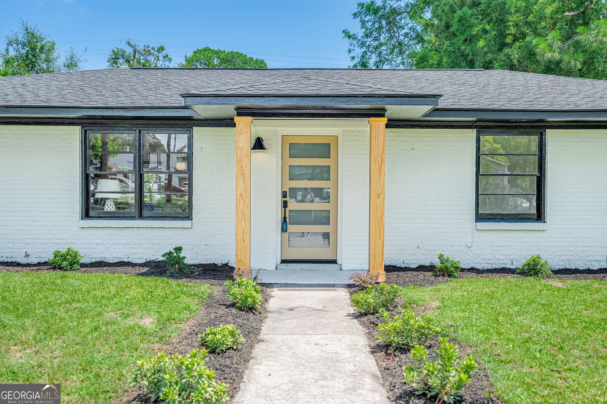 a front view of a house having yard