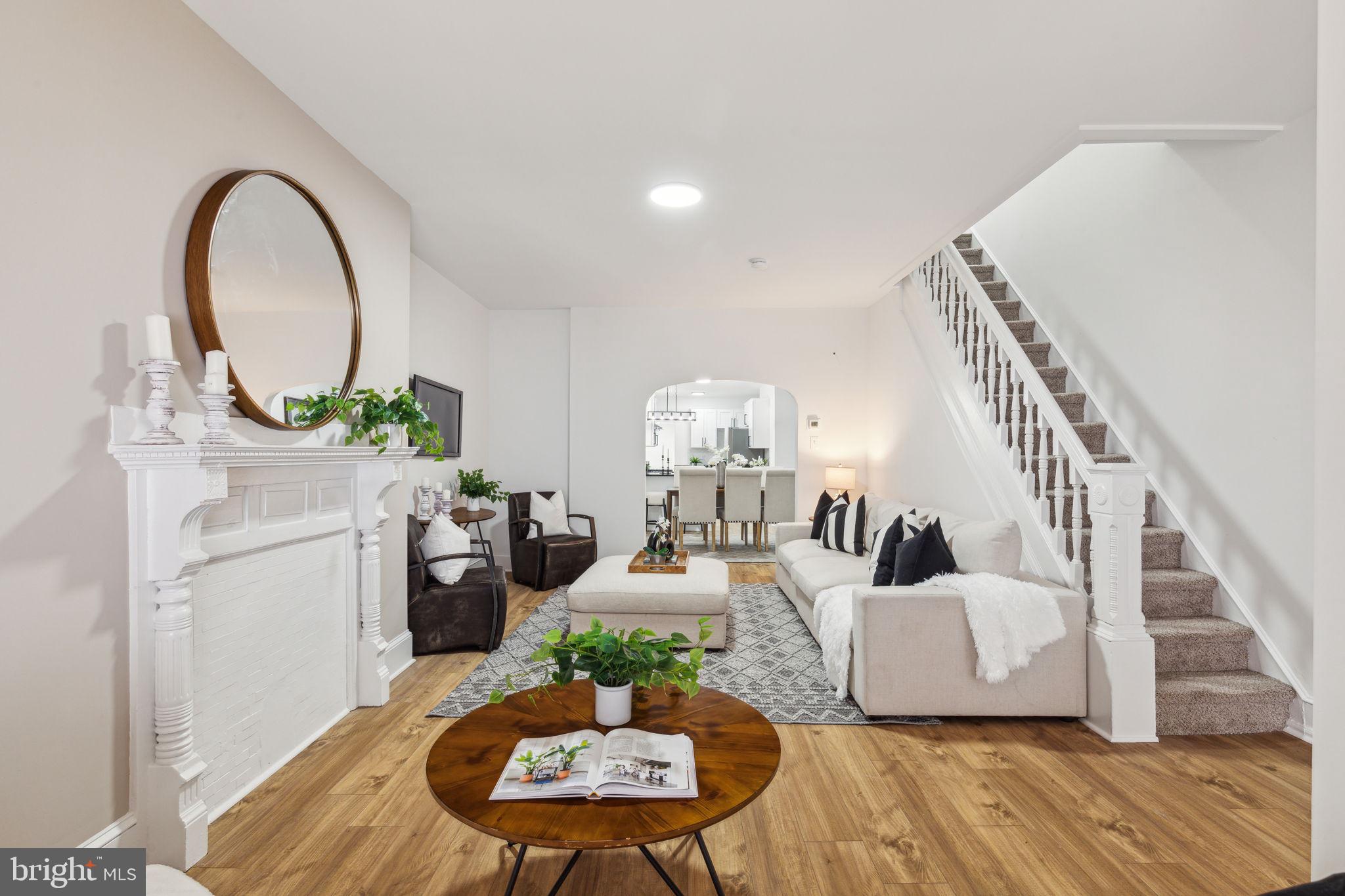 a living room with furniture and a breakfast area