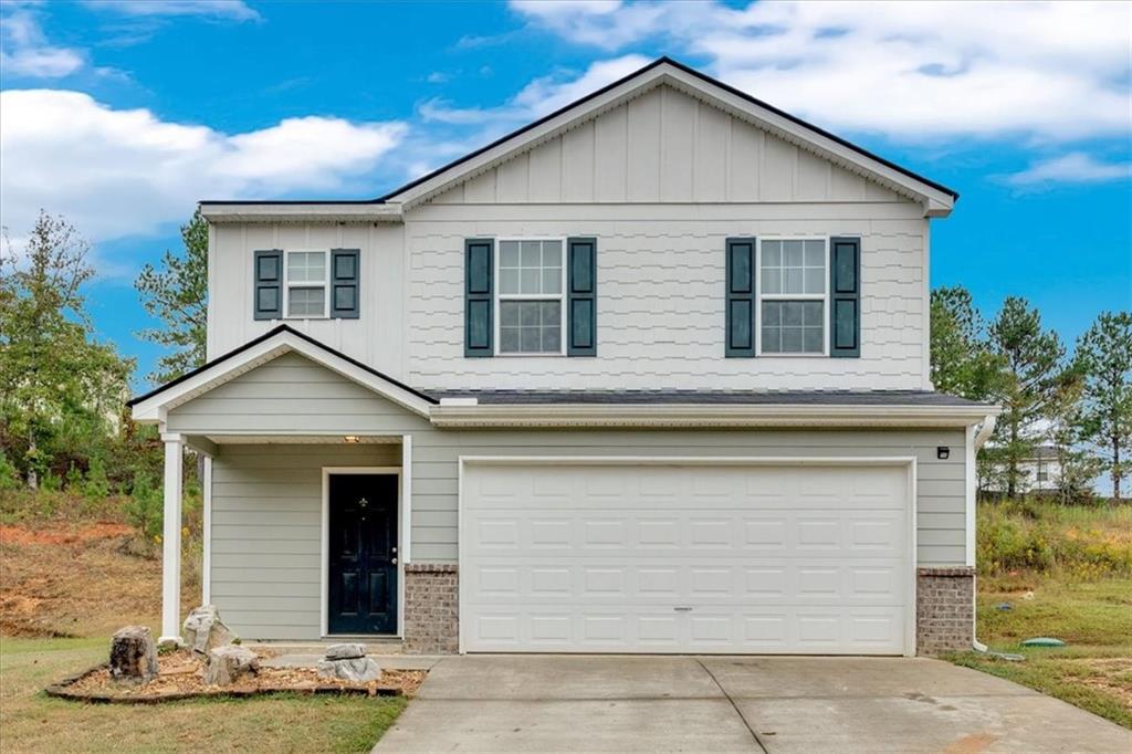 a front view of a house with garage