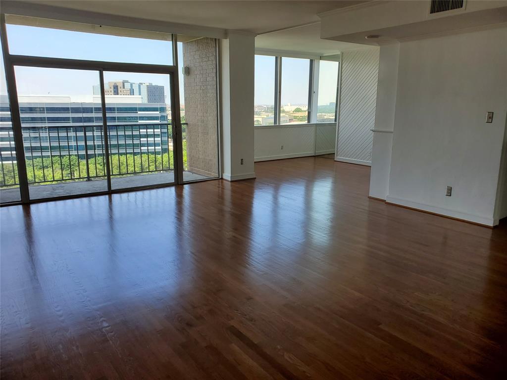 a view of an entryway with wooden floor