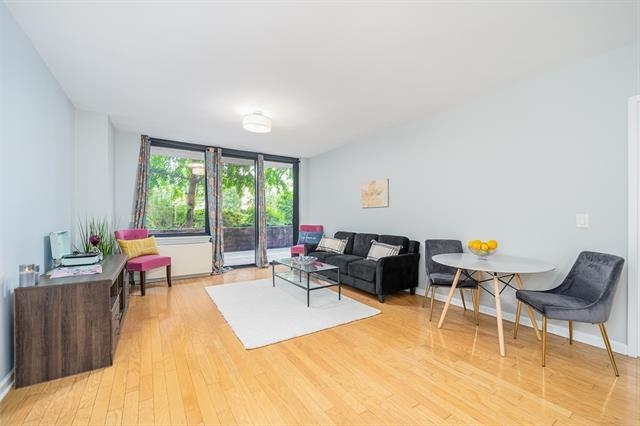 a living room with furniture and a window