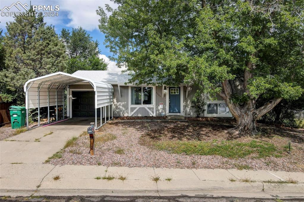 View of front facade with a carport