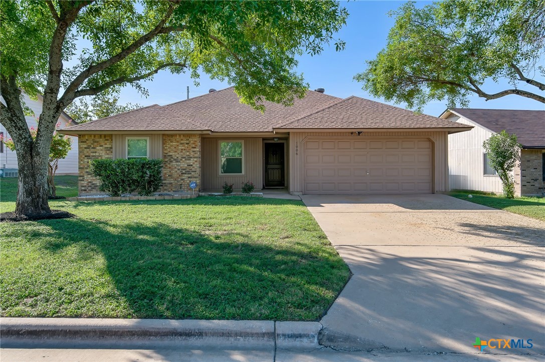 a front view of a house with yard