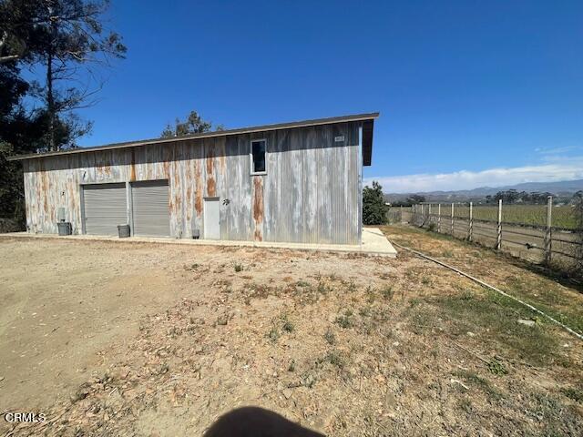 a view of a backyard of the house