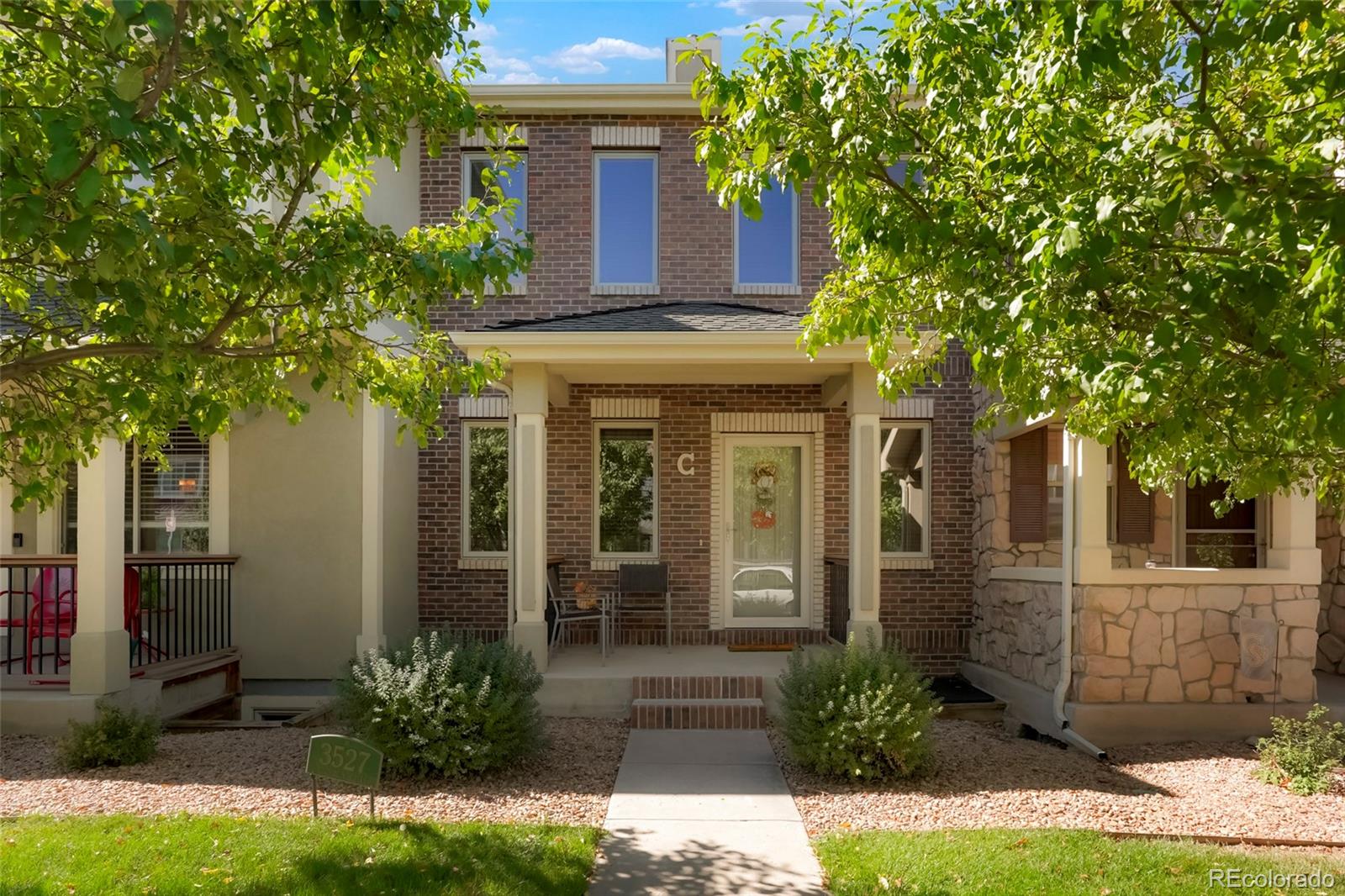 a front view of a house with garden