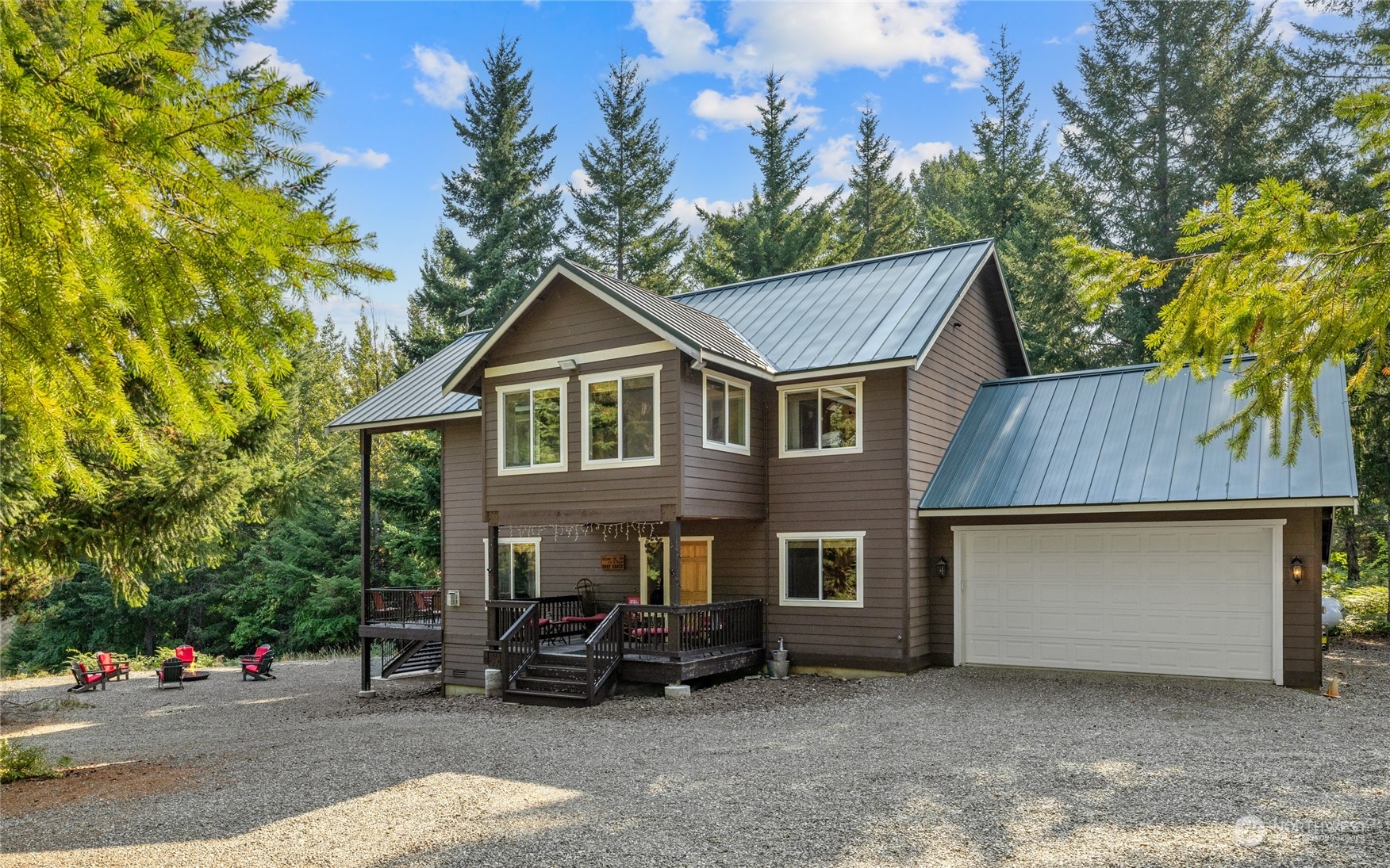 a view of a house with a patio and a yard