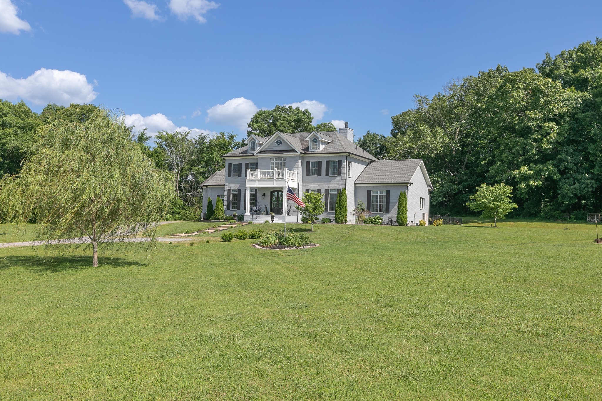 a front view of a house with garden