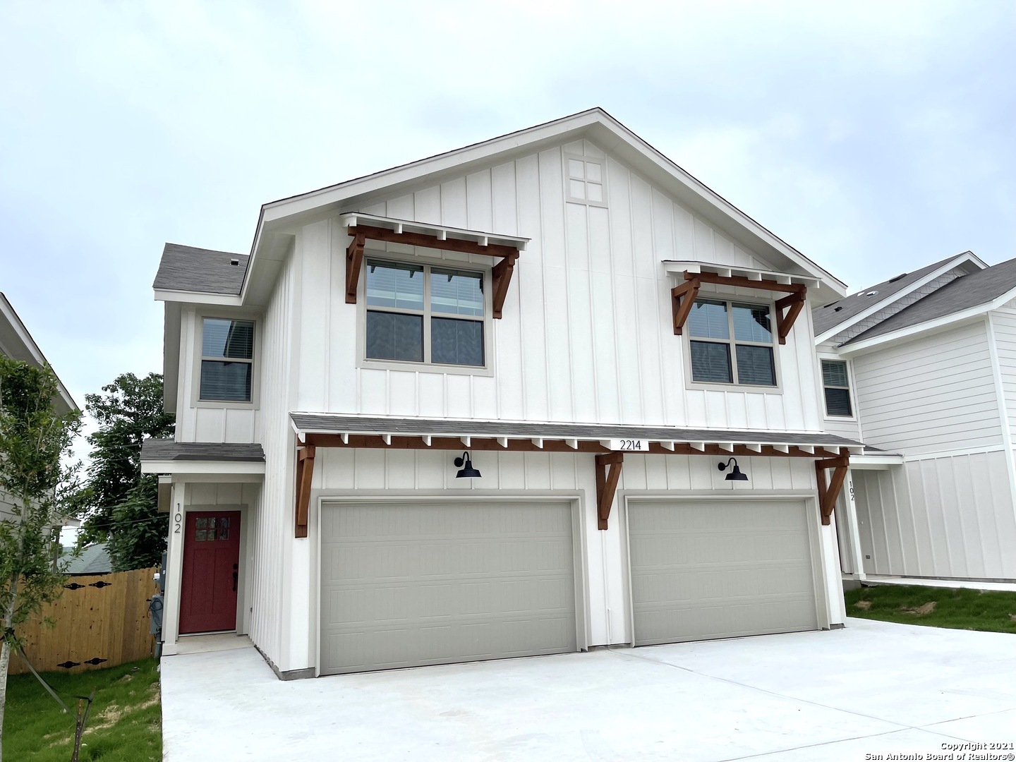 a front view of a house with garage