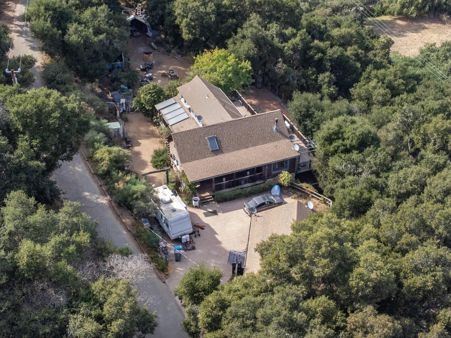 an aerial view of a house with a yard