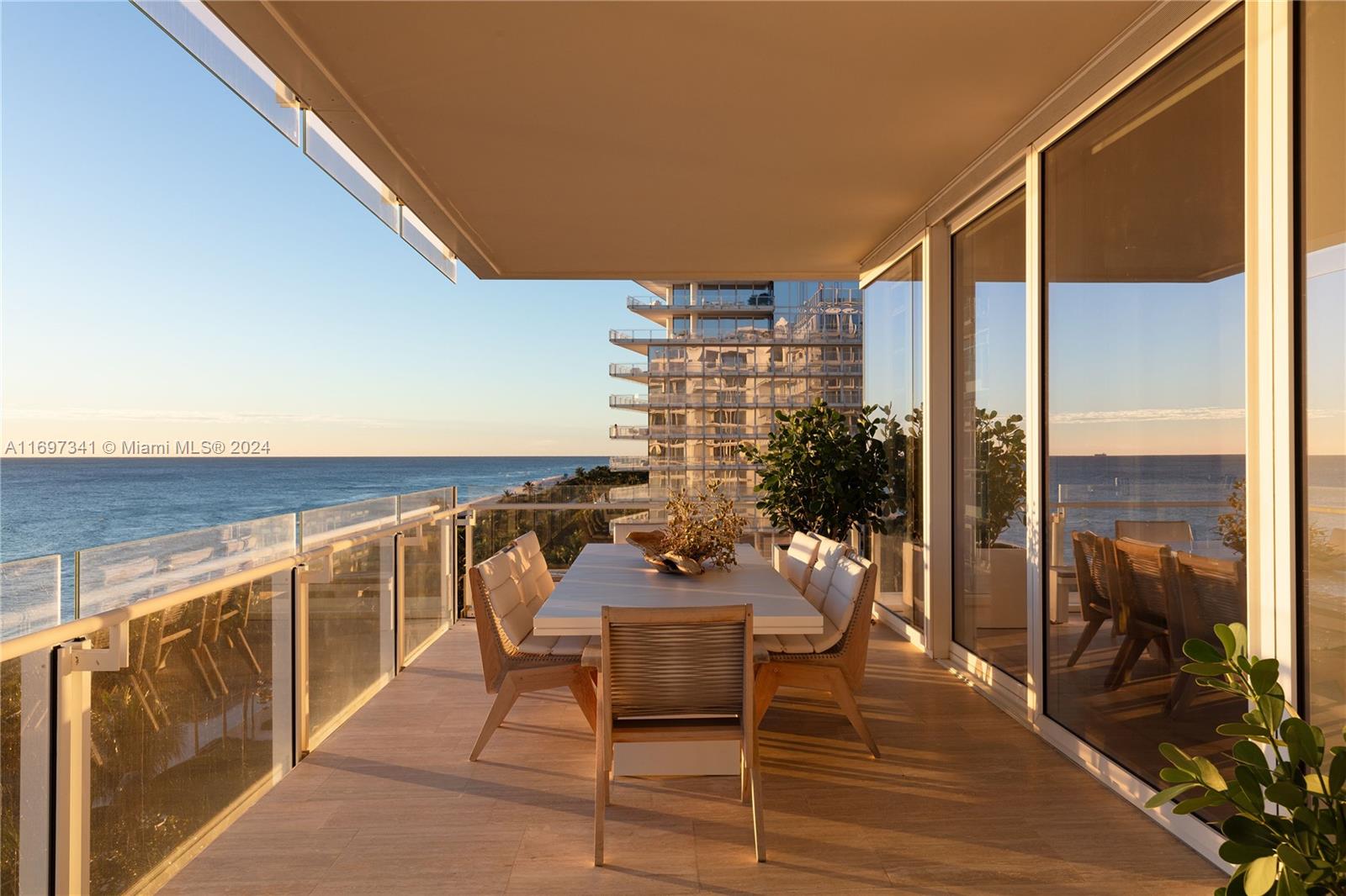 a balcony with furniture and wooden floor