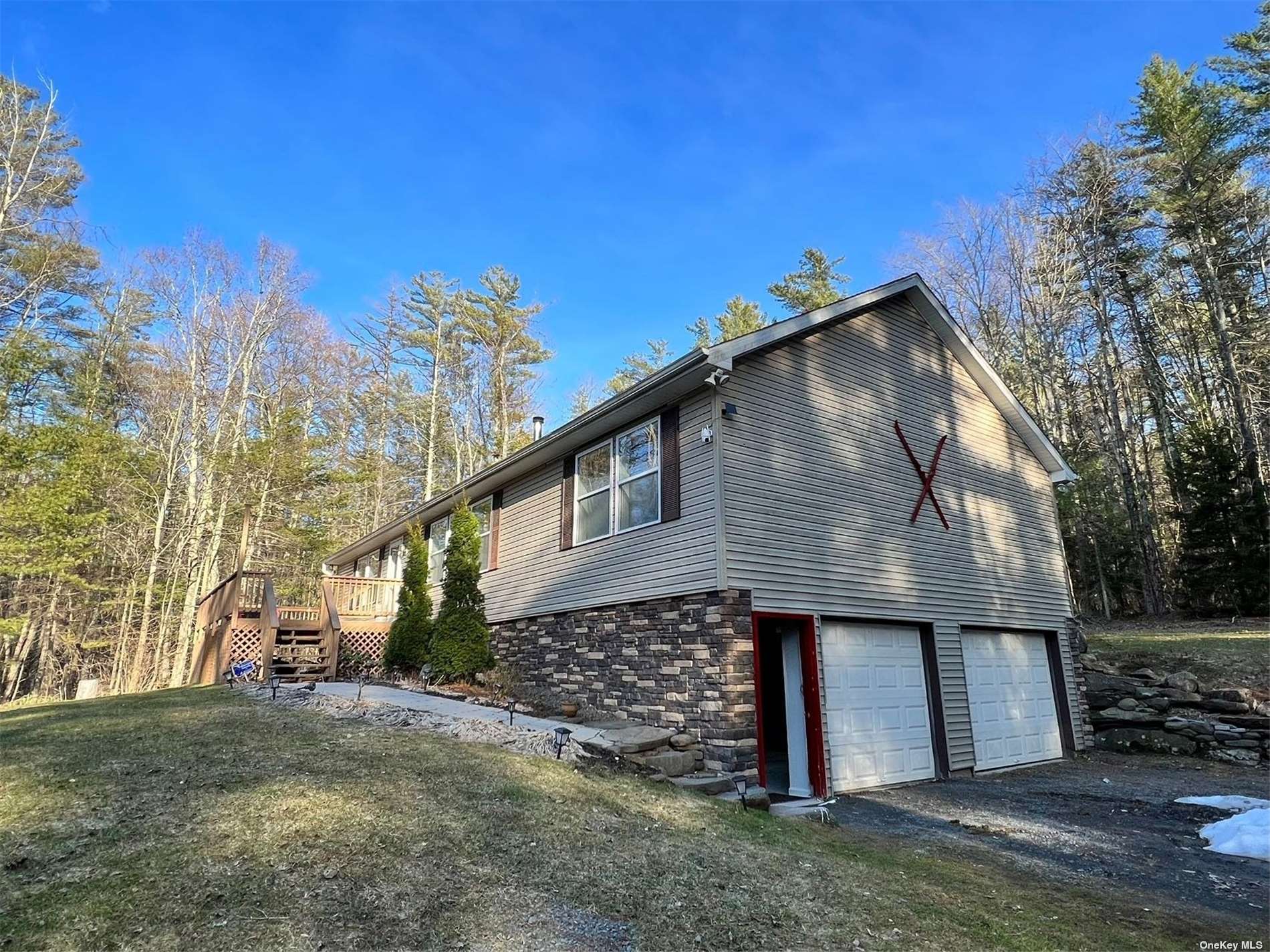 a view of a house with wooden fence