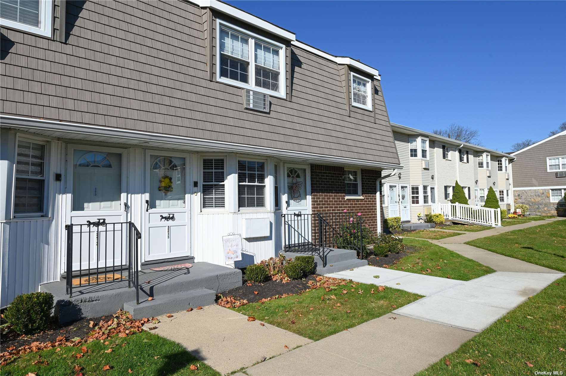 a view of a house with backyard porch and sitting area