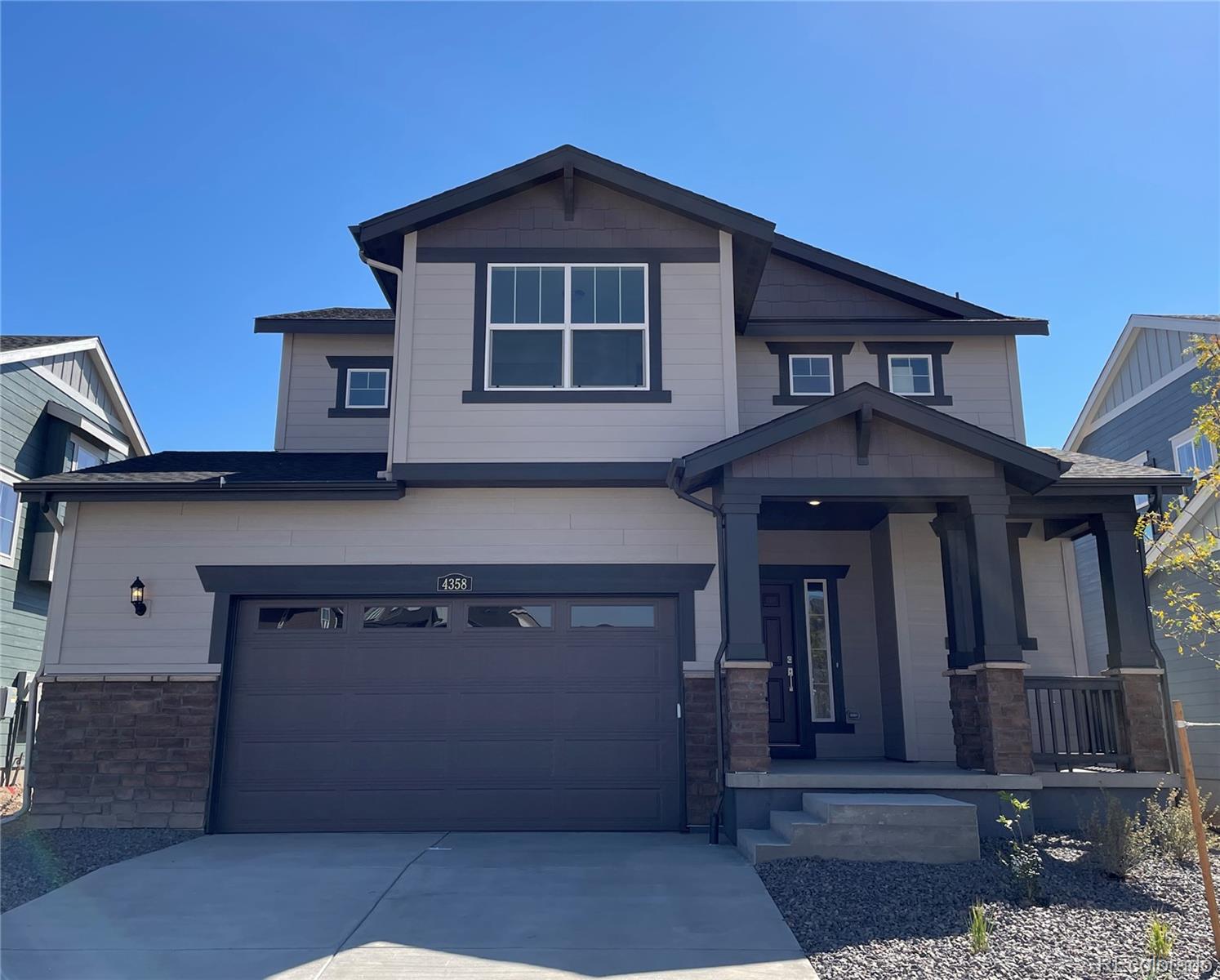 a front view of a house with garage