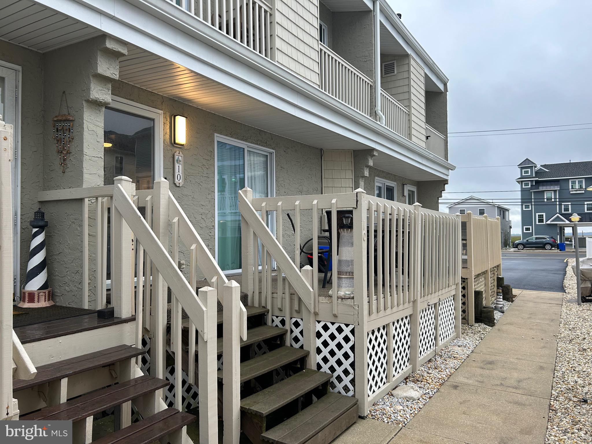 a view of front door of house with stairs