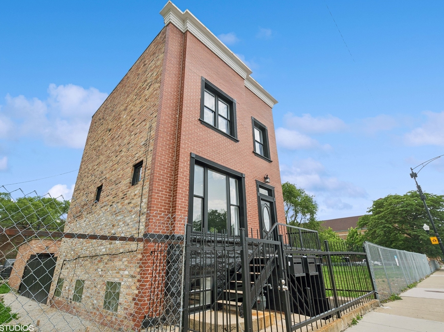 a view of a brick house with a large windows