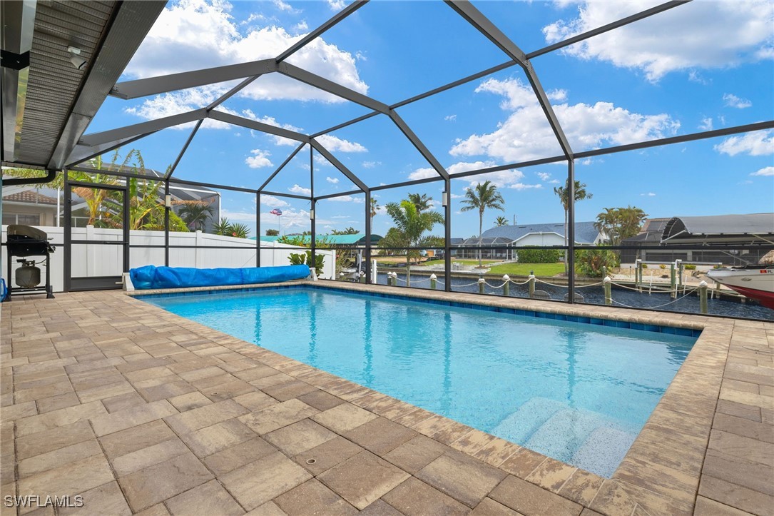 a view of a swimming pool with a lounge chairs