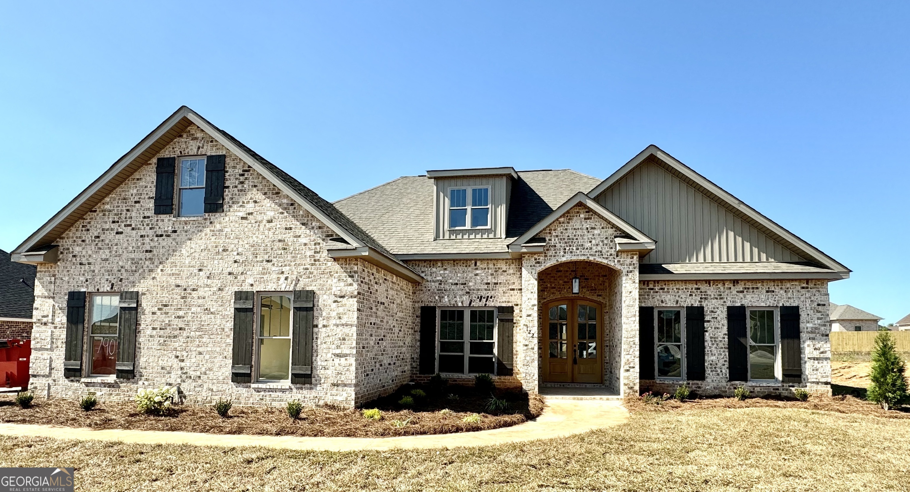 a front view of a house with a yard