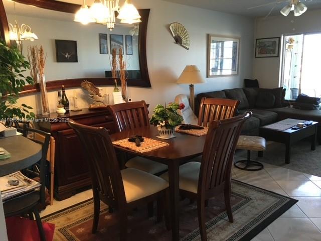 a view of a dining room with furniture and window