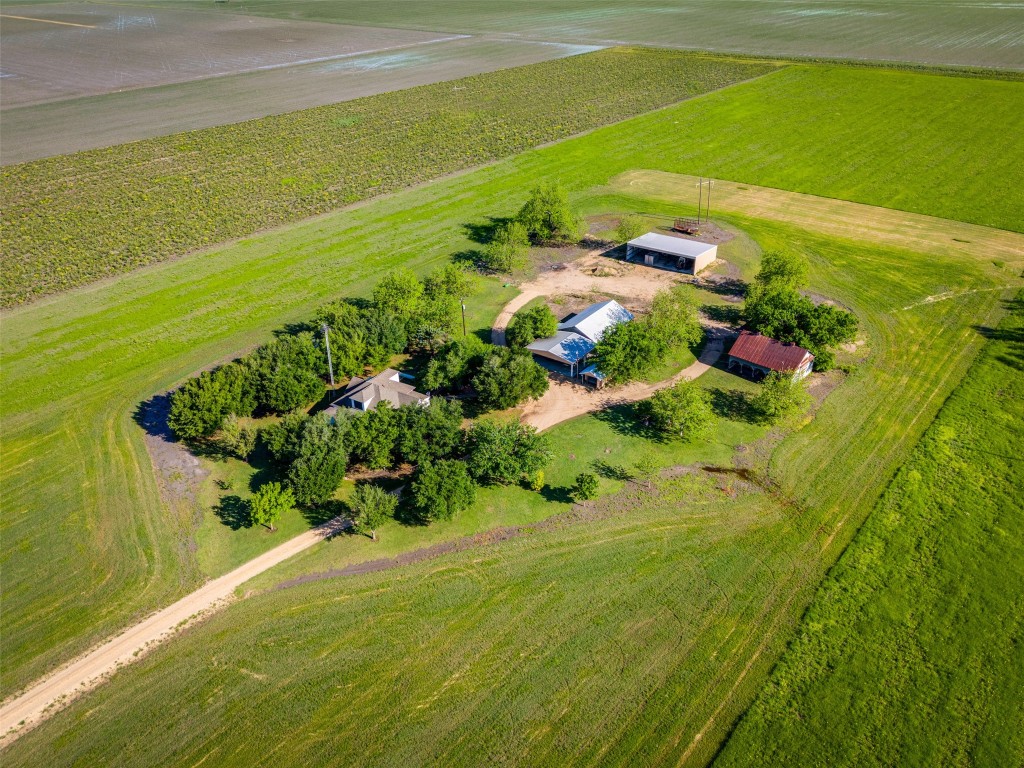 Country living on over 10 unrestricted acres with the picture perfect farm house and 5 out buildings