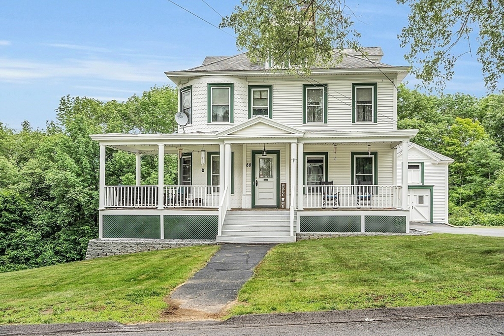 a front view of a house with a yard